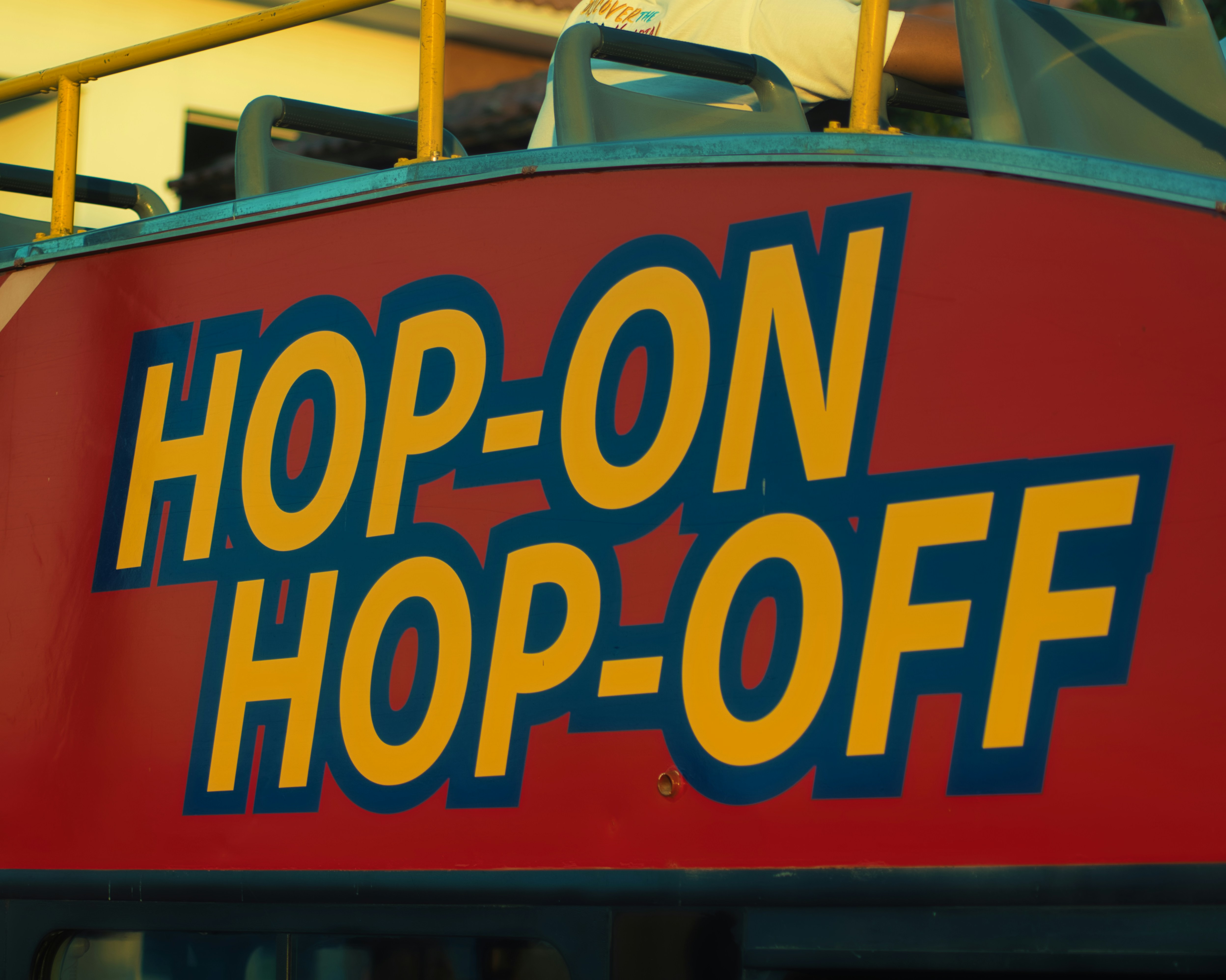Fairground ride sign reading 'Hop-On', 'Hop-Off'