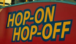 Fairground ride sign reading 'Hop-On', 'Hop-Off'